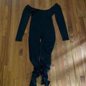 Black bodysuit that has the back open.